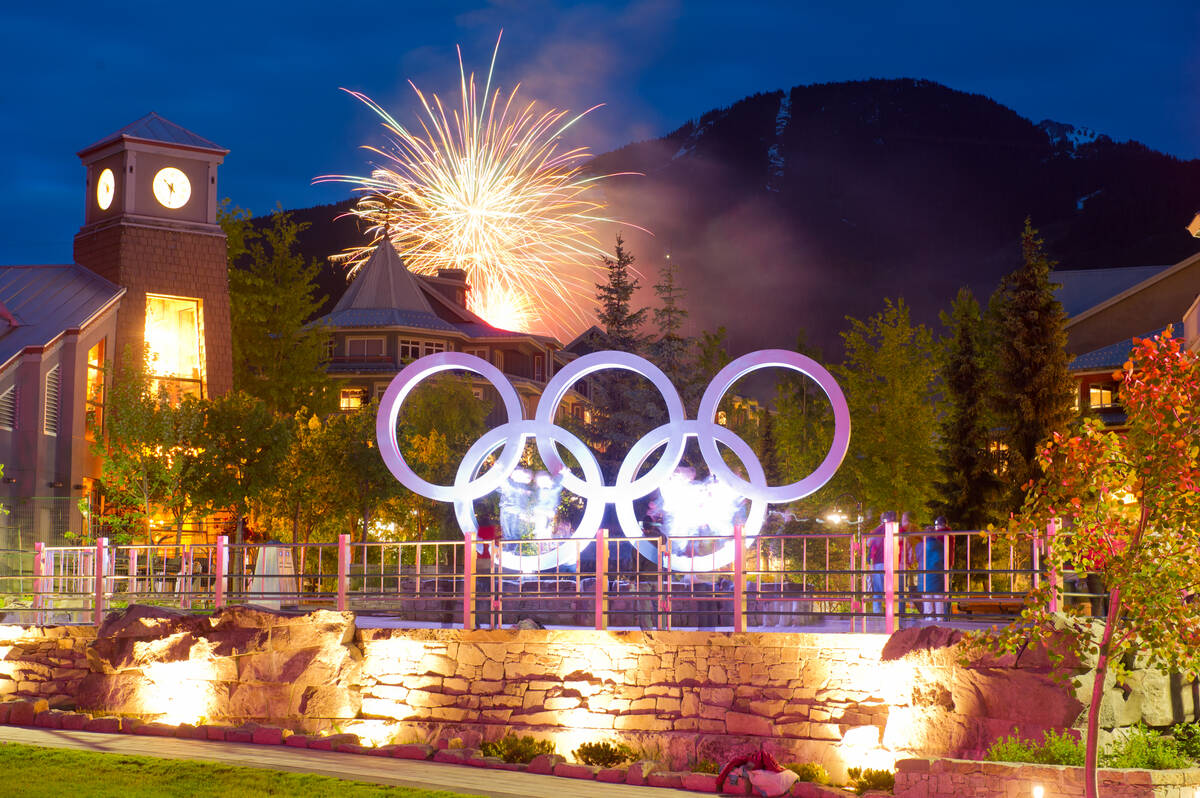canada day fireworks behind the Olympic rings